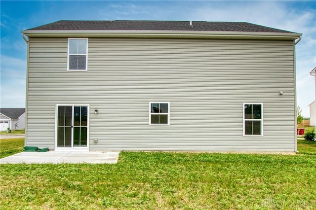 95 Whitney Way, West Milton, OH 45383 - rear view of house with a yard and a patio area