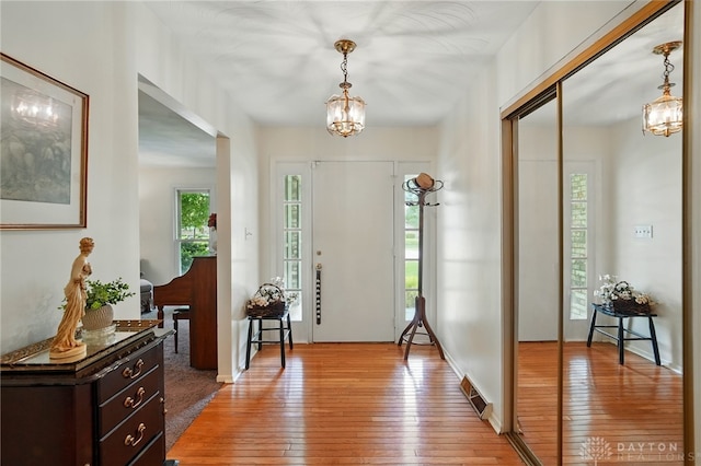 6007 Valleybrook Dr, Middletown, OH 45044 - entrance foyer with a chandelier and light wood-type flooring