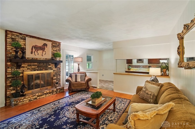 6007 Valleybrook Dr, Middletown, OH 45044 - living area featuring wood finished floors and a fireplace