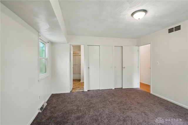 6007 Valleybrook Dr, Middletown, OH 45044 - unfurnished bedroom with carpet floors, multiple closets, and baseboards