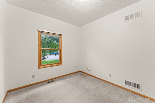 1410 Hunter Ct, Troy, OH 45373 - unfurnished room with carpet floors and a textured ceiling