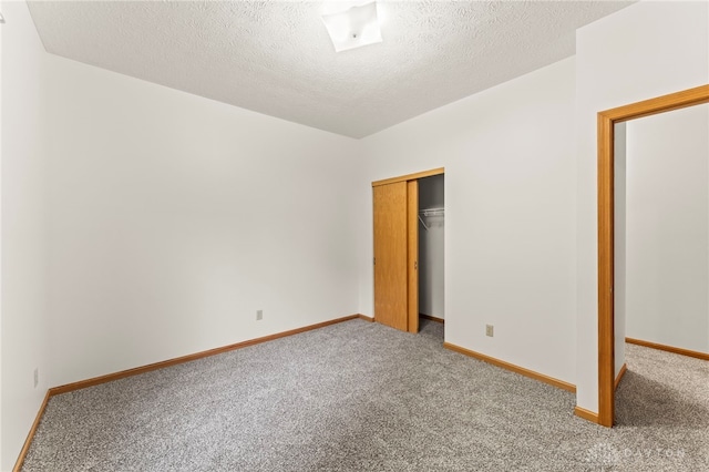 1410 Hunter Ct, Troy, OH 45373 - unfurnished bedroom featuring carpet flooring, a closet, and a textured ceiling
