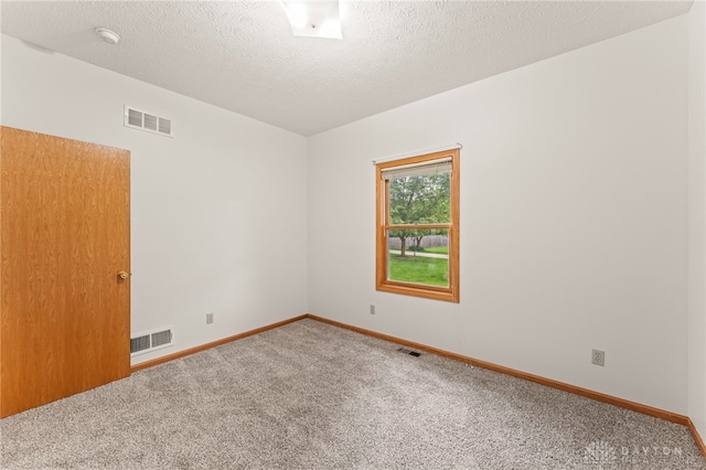 1410 Hunter Ct, Troy, OH 45373 - carpeted empty room featuring a textured ceiling and a smoke detector