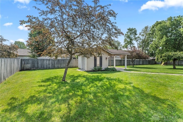 1410 Hunter Ct, Troy, OH 45373 - fenced backyard featuring an outdoor structure and a carport