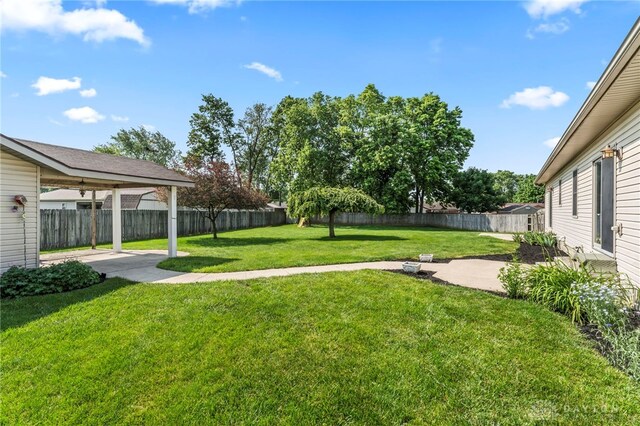 1410 Hunter Ct, Troy, OH 45373 - fenced backyard featuring a patio