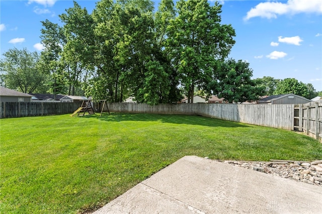1410 Hunter Ct, Troy, OH 45373 - fenced backyard featuring a playground