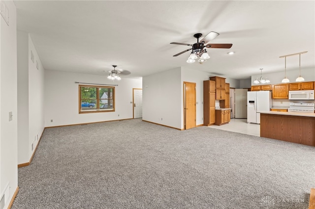 1410 Hunter Ct, Troy, OH 45373 - unfurnished living room with ceiling fan, light colored carpet, and a chandelier