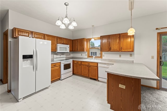 1410 Hunter Ct, Troy, OH 45373 - kitchen with white appliances, a peninsula, brown cabinetry, and light countertops