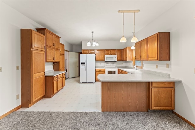 1410 Hunter Ct, Troy, OH 45373 - kitchen featuring white appliances, a chandelier, a peninsula, and light countertops