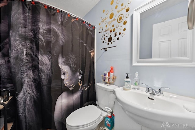 849 Princeton Ave, Fairborn, OH 45324 - bathroom featuring toilet, a sink, and curtained shower