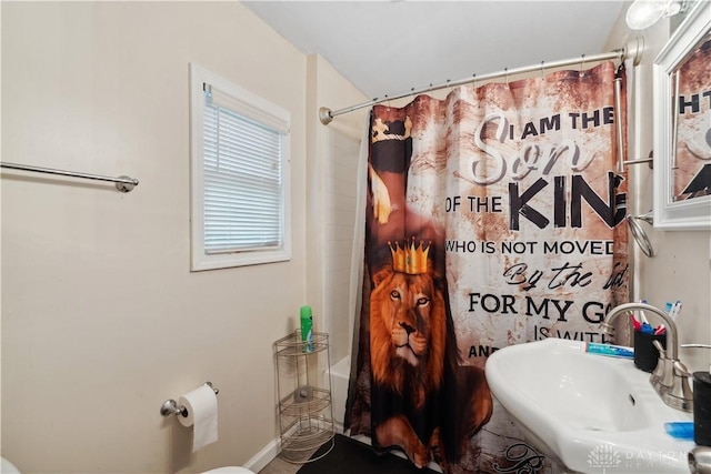 849 Princeton Ave, Fairborn, OH 45324 - bathroom with a sink, shower / bath combo with shower curtain, and toilet