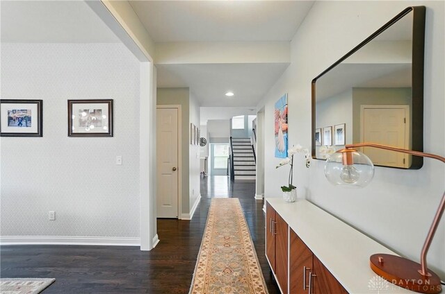 1596 Amberley Ct, Beavercreek Twp, OH 45385 - hallway with dark wood-type flooring, baseboards, stairway, and wallpapered walls