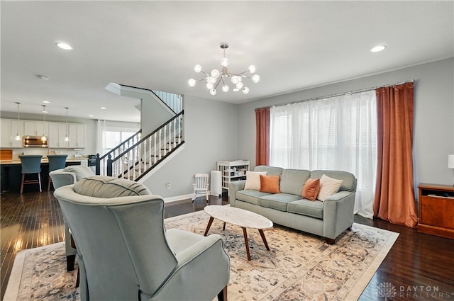 1596 Amberley Ct, Beavercreek Twp, OH 45385 - living room with stairway, a chandelier, dark wood finished floors, recessed lighting, and baseboards