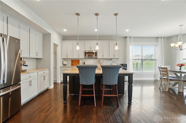 1596 Amberley Ct, Beavercreek Twp, OH 45385 - kitchen featuring appliances with stainless steel finishes, dark wood-type flooring, baseboards, white cabinets, and recessed lighting