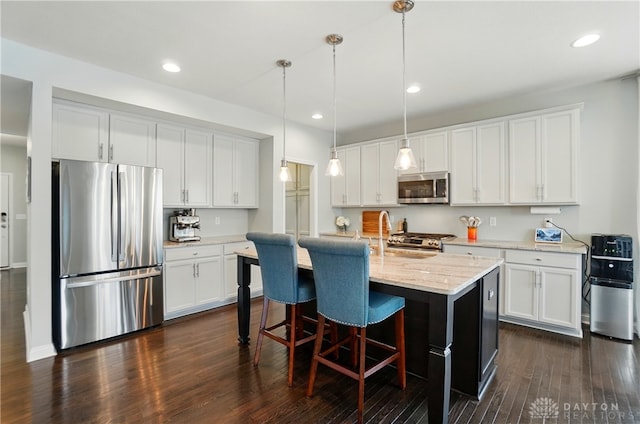 1596 Amberley Ct, Beavercreek Twp, OH 45385 - kitchen featuring stainless steel appliances, dark wood-style floors, white cabinetry, and recessed lighting