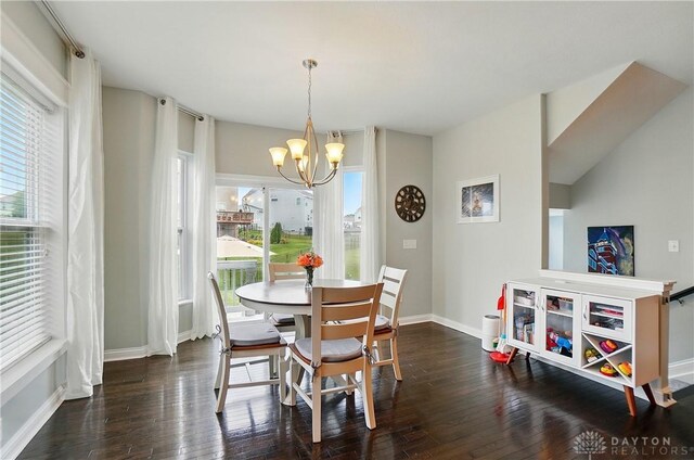 1596 Amberley Ct, Beavercreek Twp, OH 45385 - dining space featuring a chandelier, wood-type flooring, and baseboards