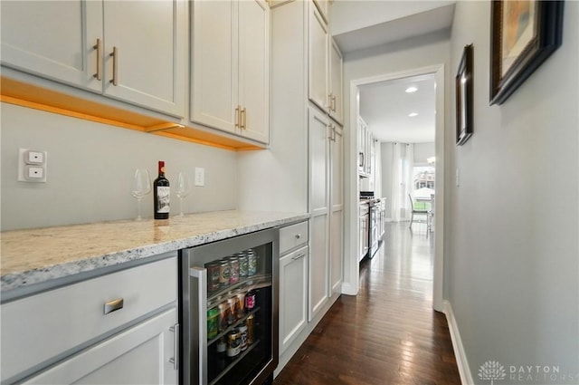 1596 Amberley Ct, Beavercreek Twp, OH 45385 - indoor dry bar with wine cooler, dark wood finished floors, recessed lighting, and baseboards