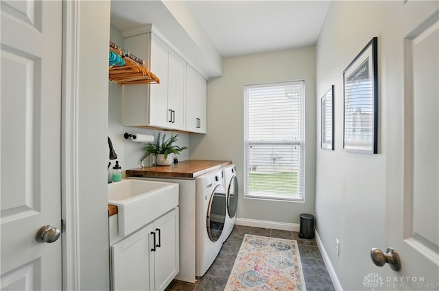 1596 Amberley Ct, Beavercreek Twp, OH 45385 - laundry room with separate washer and dryer, cabinet space, and baseboards