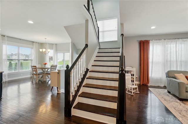 1596 Amberley Ct, Beavercreek Twp, OH 45385 - stairs with a chandelier, baseboards, wood-type flooring, and recessed lighting
