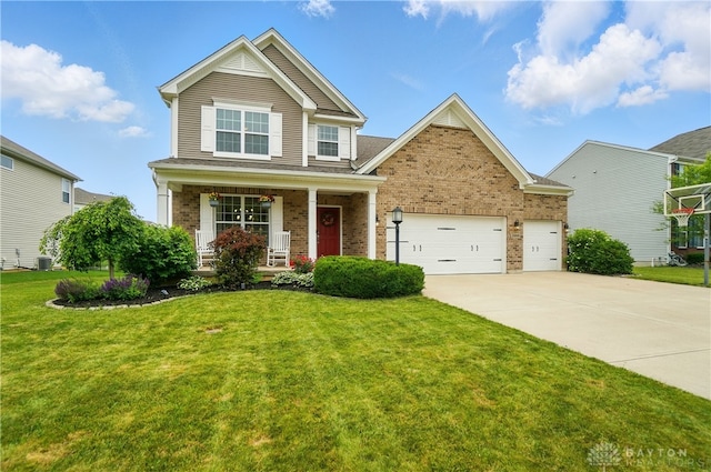 1596 Amberley Ct, Beavercreek Twp, OH 45385 - view of front of property with brick siding, driveway, a porch, a front lawn, and a garage
