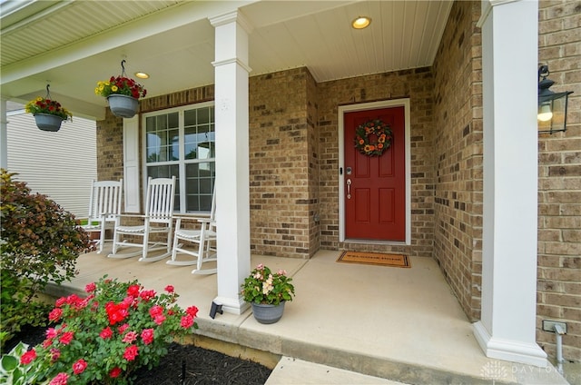 1596 Amberley Ct, Beavercreek Twp, OH 45385 - property entrance featuring covered porch and brick siding