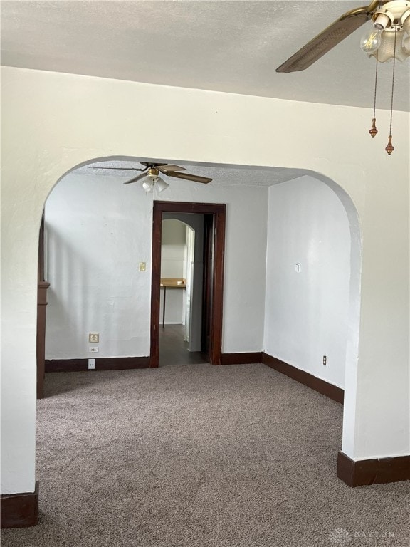 2821 E 5th St Unit 2819, Dayton, OH 45403 - carpeted empty room with a ceiling fan and arched walkways