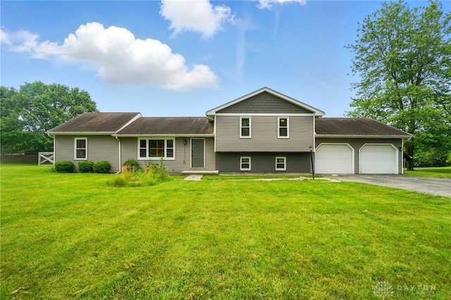 3682 Abbey Ln, Mechanicsburg, OH 43044 - tri-level home with an attached garage, asphalt driveway, and a front lawn
