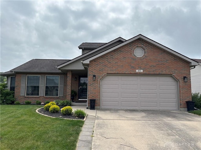 95 Fox Harbor Dr, Troy, OH 45373 - view of front facade featuring driveway, brick siding, a front yard, and a garage