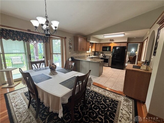 95 Fox Harbor Dr, Troy, OH 45373 - dining space featuring lofted ceiling and a chandelier