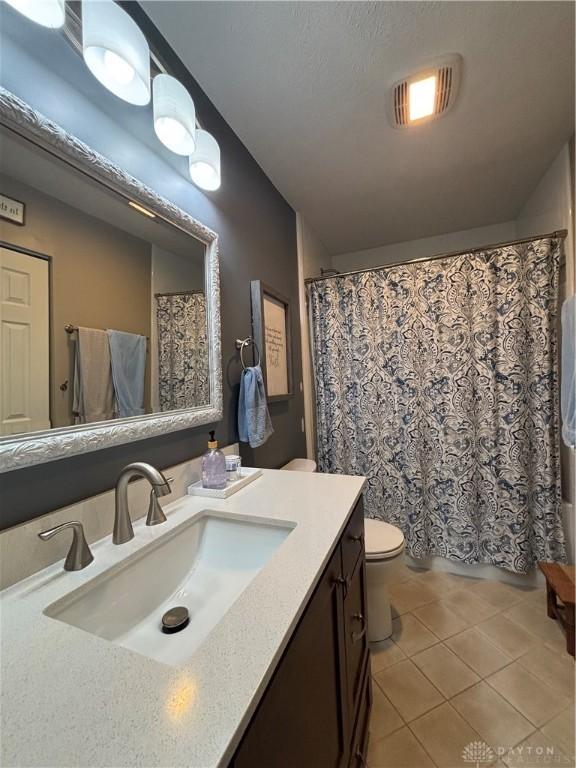 95 Fox Harbor Dr, Troy, OH 45373 - bathroom featuring vanity, tile patterned flooring, toilet, and a shower with curtain