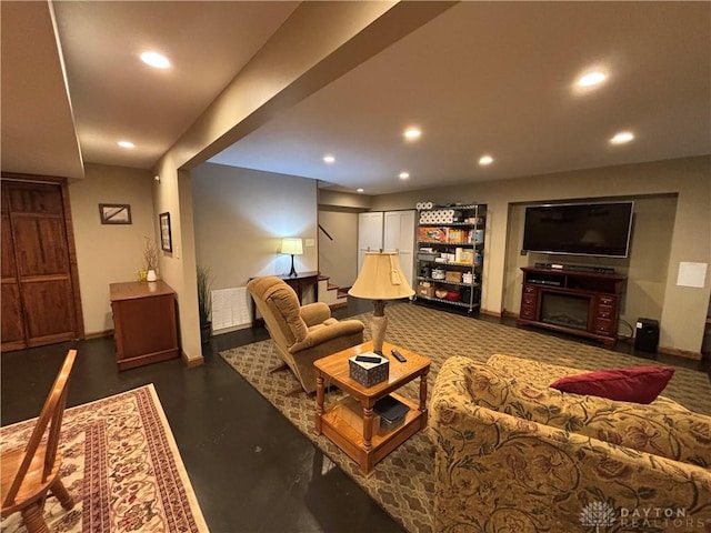 95 Fox Harbor Dr, Troy, OH 45373 - living area with recessed lighting, baseboards, concrete floors, and a fireplace