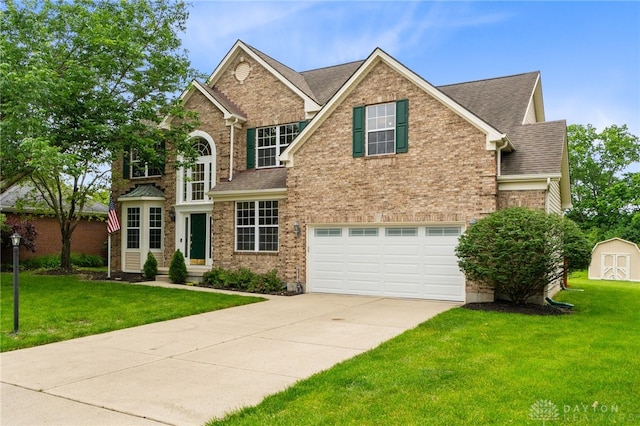 2159 Bassett Ct, Beavercreek, OH 45434 - traditional-style home with driveway, a front yard, an attached garage, brick siding, and a shingled roof