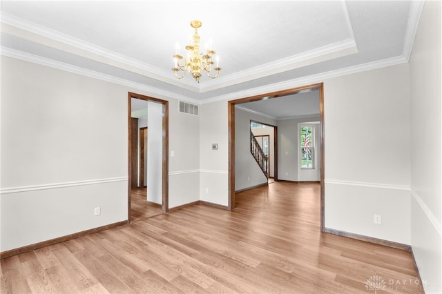 2159 Bassett Ct, Beavercreek, OH 45434 - empty room featuring a chandelier, light wood-type flooring, baseboards, crown molding, and stairs