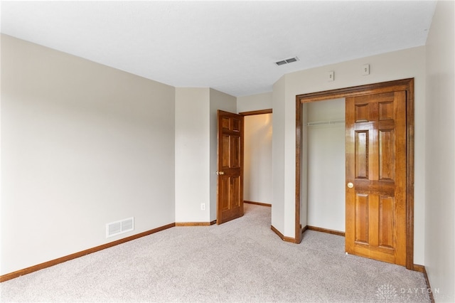 2159 Bassett Ct, Beavercreek, OH 45434 - unfurnished bedroom with light carpet, baseboards, and a closet