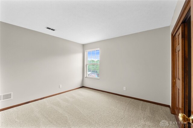 2159 Bassett Ct, Beavercreek, OH 45434 - unfurnished bedroom with baseboards, carpet flooring, and a closet
