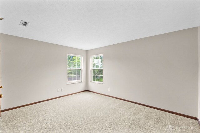 2159 Bassett Ct, Beavercreek, OH 45434 - carpeted empty room featuring baseboards