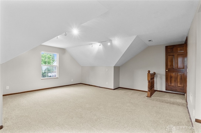 2159 Bassett Ct, Beavercreek, OH 45434 - additional living space featuring light carpet, lofted ceiling, and baseboards