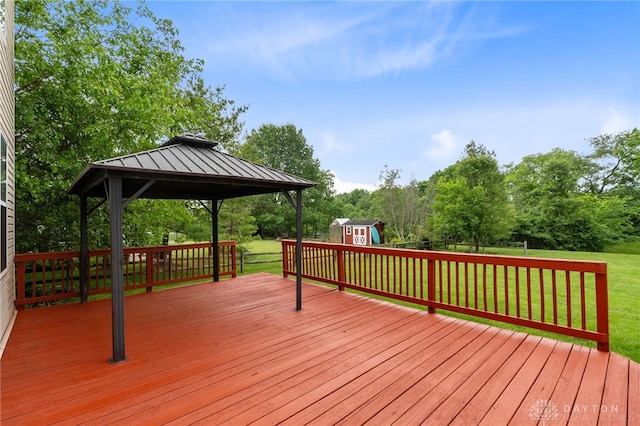 2159 Bassett Ct, Beavercreek, OH 45434 - deck featuring a gazebo, a lawn, and view of scattered trees