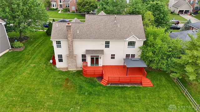 2159 Bassett Ct, Beavercreek, OH 45434 - back of property with a deck, a yard, and a shingled roof
