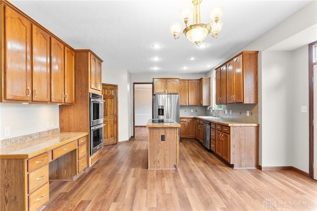 2159 Bassett Ct, Beavercreek, OH 45434 - kitchen featuring appliances with stainless steel finishes, light countertops, light wood-style floors, a chandelier, and recessed lighting