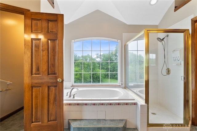 2159 Bassett Ct, Beavercreek, OH 45434 - bathroom with a bath, a stall shower, lofted ceiling, and tile patterned flooring