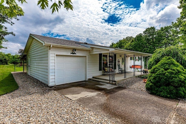 4292 Terrace Rd, College Corner, OH 45003 - ranch-style home with a porch, an attached garage, and driveway