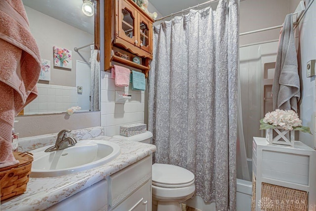 4292 Terrace Rd, College Corner, OH 45003 - full bathroom featuring vanity, toilet, shower / tub combo with curtain, and tasteful backsplash