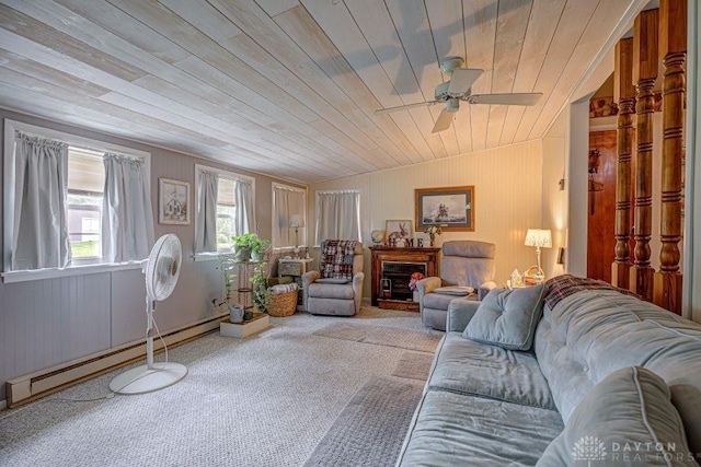 4292 Terrace Rd, College Corner, OH 45003 - living area featuring ceiling fan, carpet flooring, wooden ceiling, a baseboard radiator, and wood walls