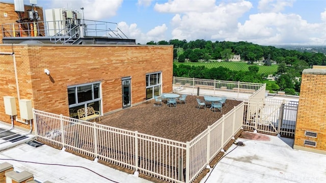 2230 S Patterson Blvd Unit 21, Dayton, OH 45409 - view of side of property featuring brick siding and a patio area