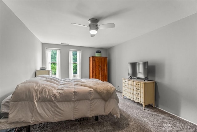 2230 S Patterson Blvd Unit 21, Dayton, OH 45409 - carpeted bedroom with ceiling fan and baseboards