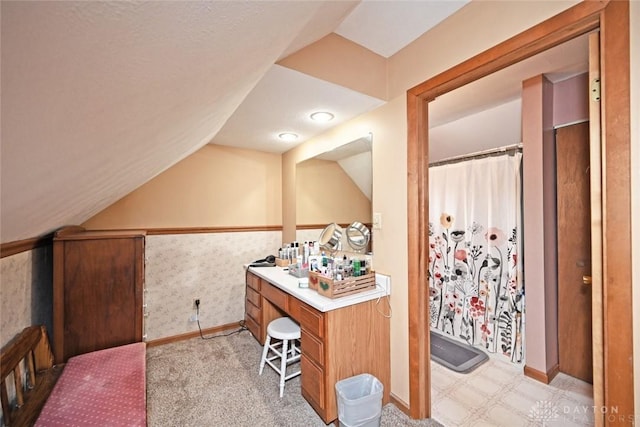 1064 Wilmington Ave, Dayton, OH 45420 - bathroom with lofted ceiling, baseboards, vanity, and a shower with shower curtain