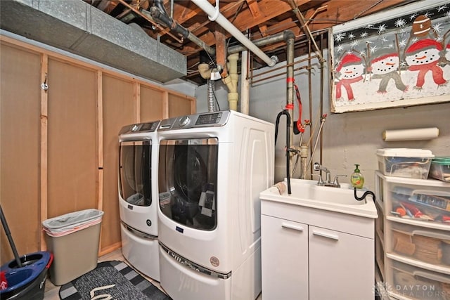 1064 Wilmington Ave, Dayton, OH 45420 - washroom with washer and dryer and cabinet space