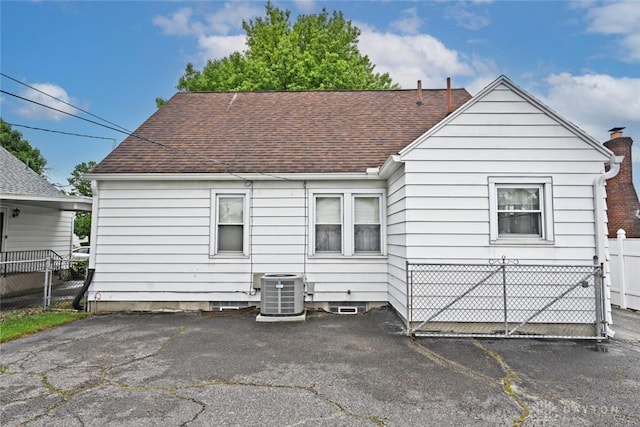 1064 Wilmington Ave, Dayton, OH 45420 - rear view of property featuring cooling unit and a shingled roof