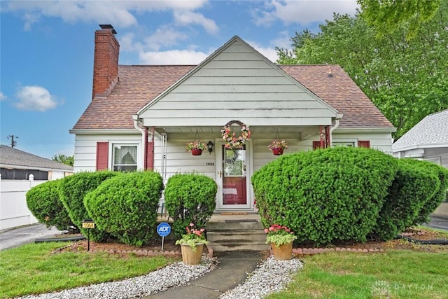 1064 Wilmington Ave, Dayton, OH 45420 - bungalow-style home featuring a chimney, a shingled roof, and a porch